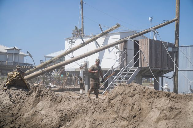 Members of the U.S. military assisting in the rebuilding effort on Grand