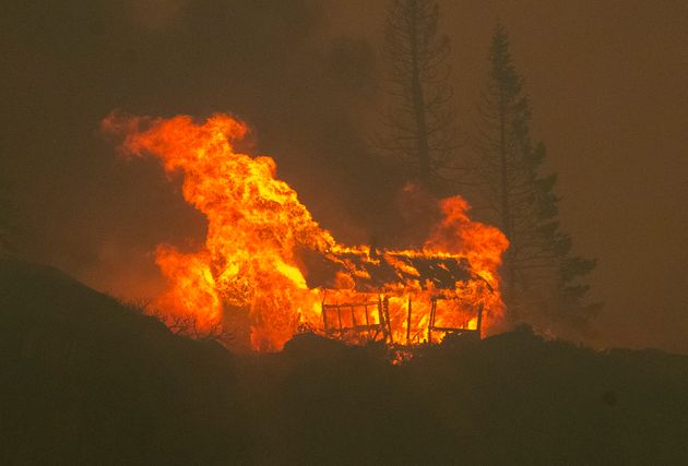 In Meyers, California, a structure is seen up in flames as the Caldor fire descends into the Tahoe Basin...