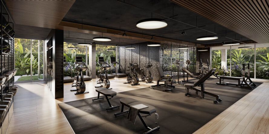 gym with wooden floors and view to tropical plants