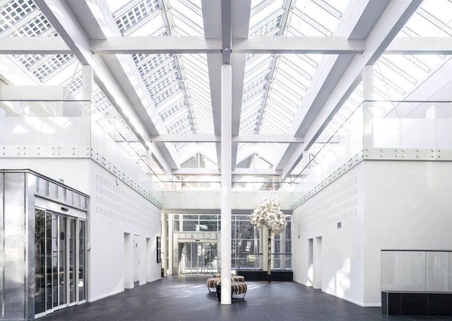 White hallway with a open glass ceiling