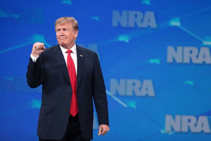 Former President Donald Trump gestures to guests at the NRA-ILA Leadership Forum at the 148th NRA Annual Meetings & Exhibits on April 26, 2019 in Indianapolis, Indiana. (Photo by Scott Olson/Getty Images)
